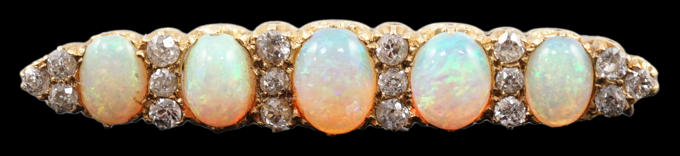 An early 20th century gold, diamond and oval white opal cluster set clip bar brooch